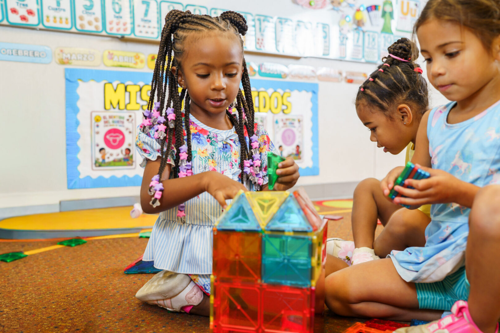 Child building with colorful blocks