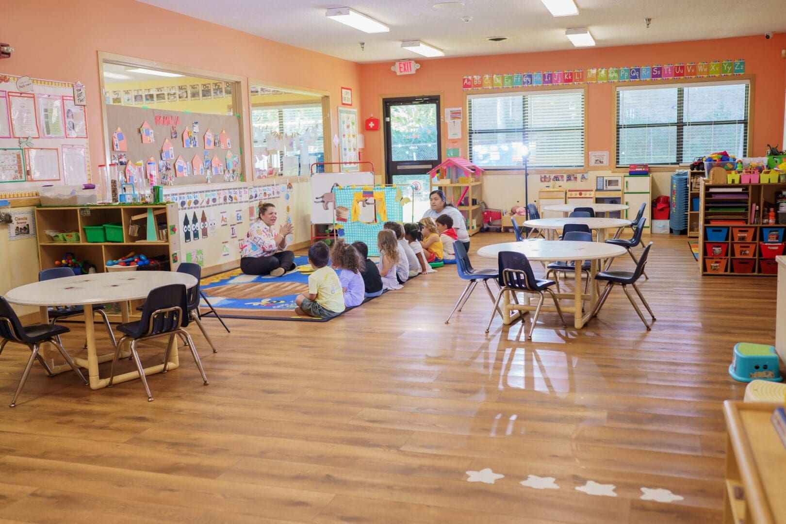 Children listening attentively to a teacher's story.
