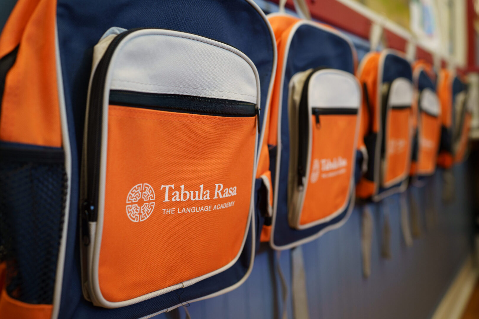 Close-up of orange and blue backpacks