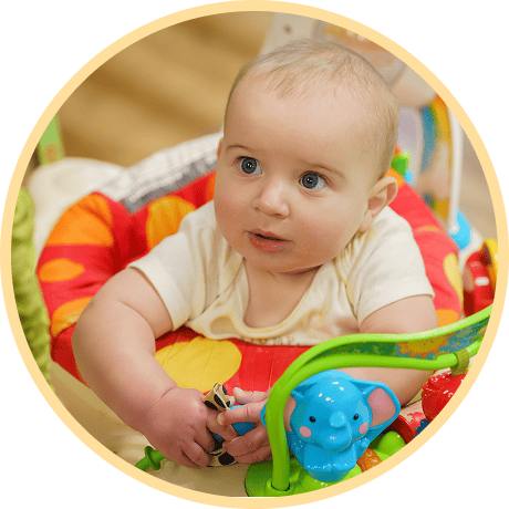 Baby playing with colorful toys