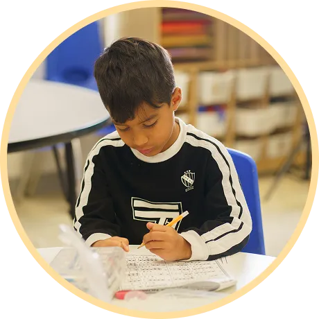 Young student focused on writing