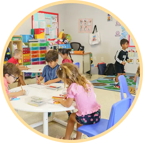 Children engaged in creative activities at tables.