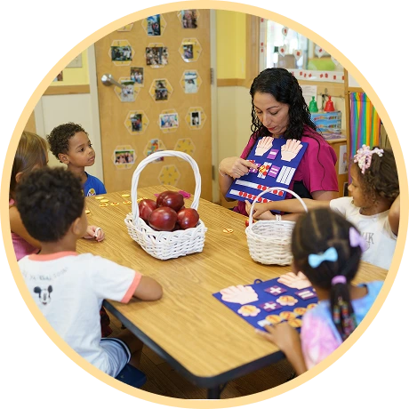 Instructor engaging children with hands-on activity.